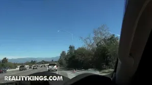 Two girls are having fun in the car and