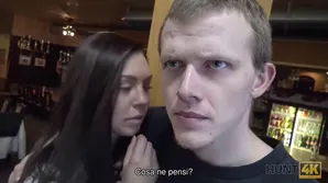 A young guy watches as his girlfriend is