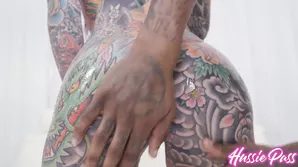 Tattooed redhead Tigerlilly is a BDSM