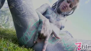 Alternative couple with body art enjoys